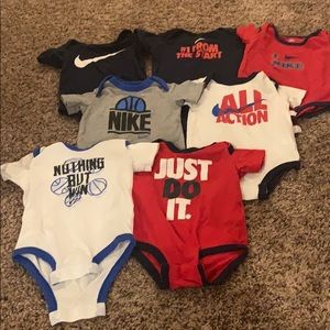 6 Nike onesies